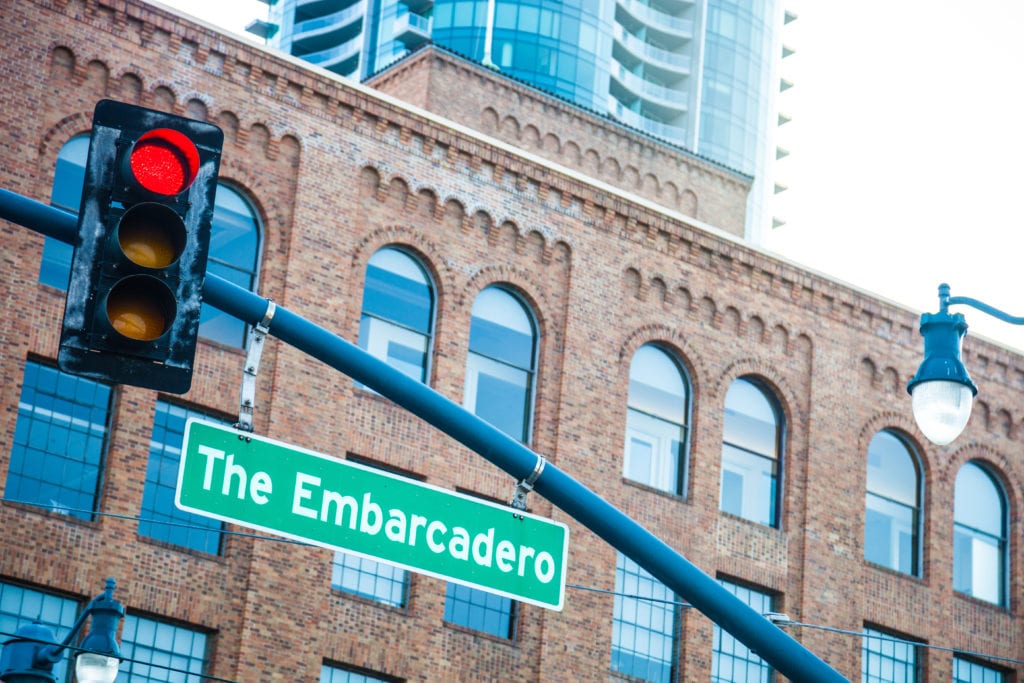 street sign for the embarcadero in san francisco across from bayside village